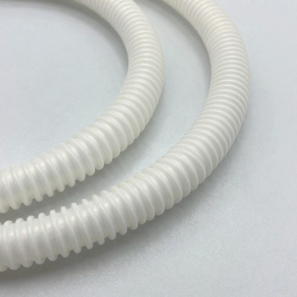 Photorealistic close-up of corrugated convoluted fluoropolymer tubing with visible ridges and flexible bends, clean industrial product photography on pale lab surface, no text, no logo, no watermark